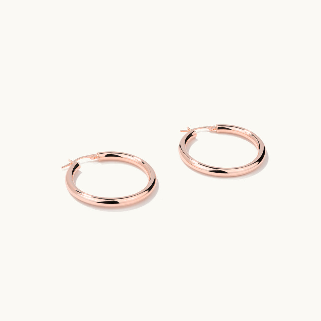 Face view of Jewellers District's Gold Hoop Earrings in 14k Rose Gold