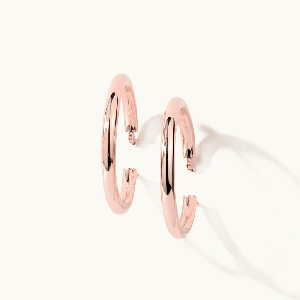 Standing view of Jewellers District's Gold Hoop Earrings in 14k Rose Gold