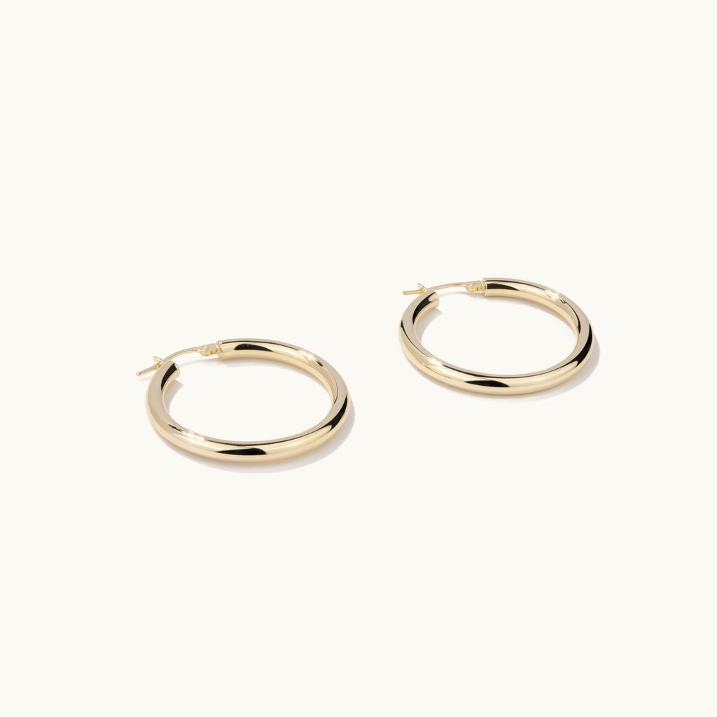 Face view of Jewellers District's Gold Hoop Earrings in 14k Yellow Gold