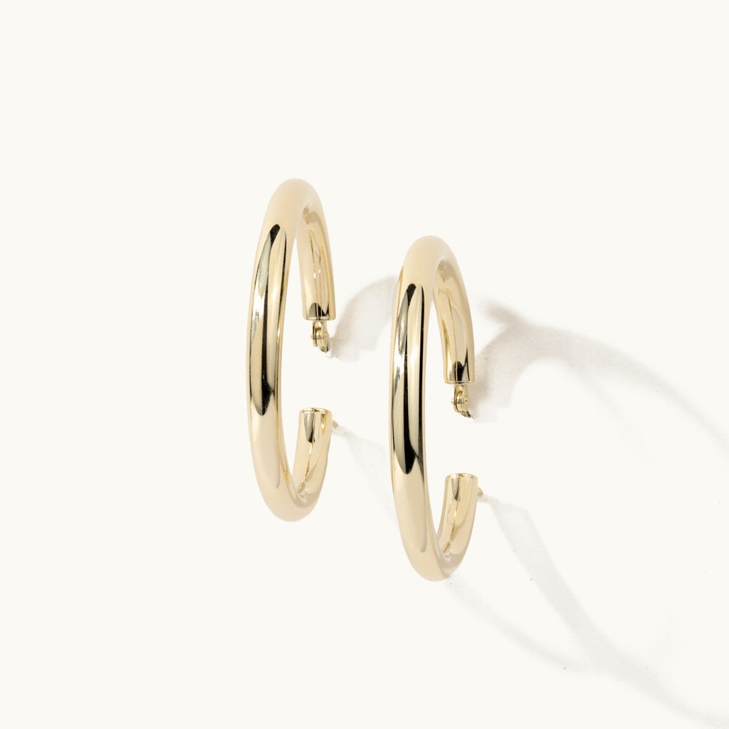 Standing view of Jewellers District's Gold Hoop Earrings in 14k Yellow Gold