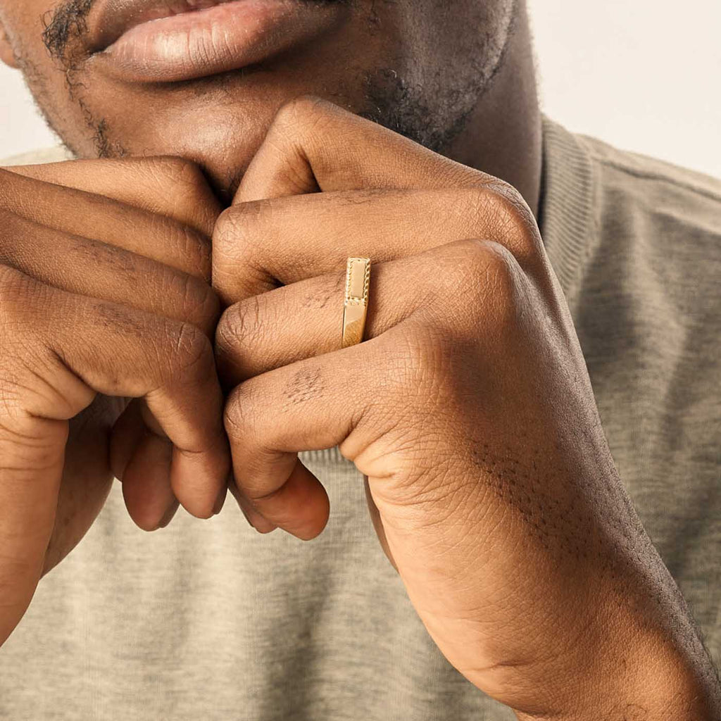 Model wearing Jewellers District's Signet Wedding Ring with Twist Accents in 14k Yellow Gold #2