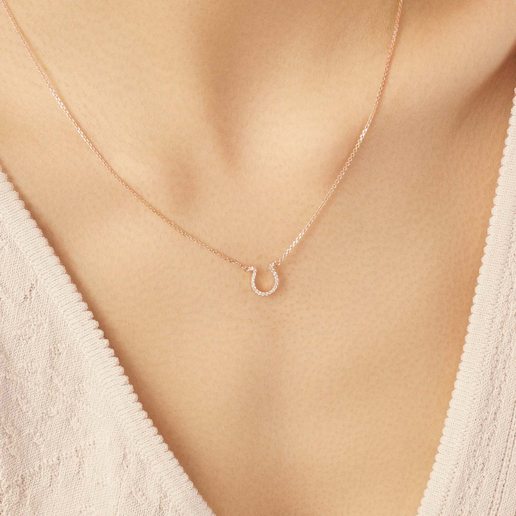 Model wearing Jewellers District's Horseshoe Diamond Pavé Pendant Necklace in 10k Rose Gold #2