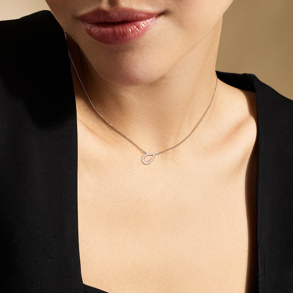 Model wearing Jewellers District's Pear Diamond Pavé Pendant Necklace in 10k Rose Gold #4