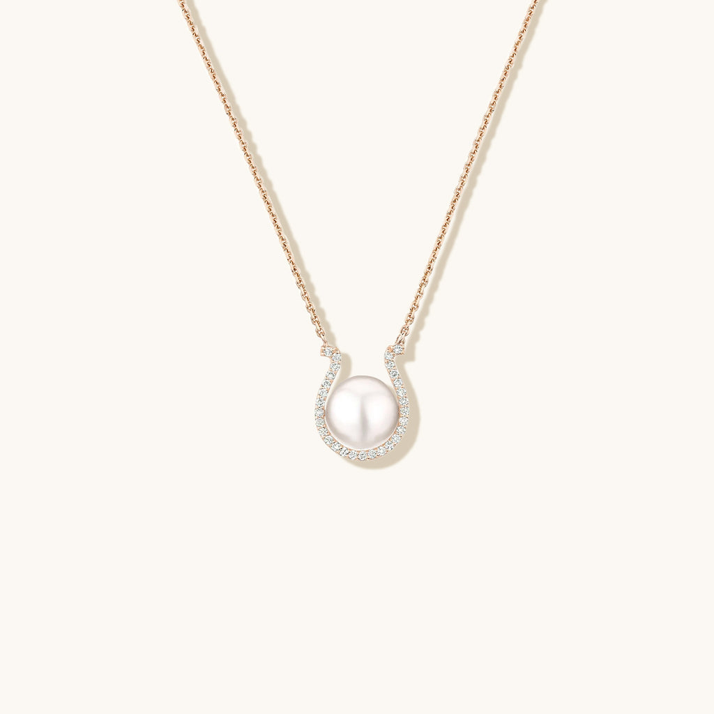 Face view of Jewellers District's Horseshoe Freshwater Pearl Pendant Necklace with Diamond Pavé in 14k Rose Gold