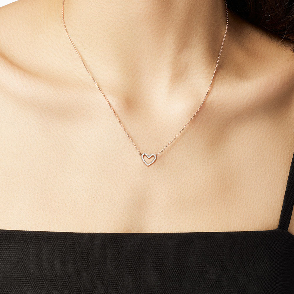 Model wearing Jewellers District's Heart Diamond Pavé Pendant Necklace in 10k Rose Gold #2