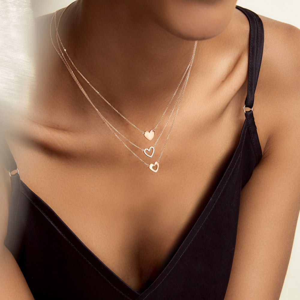 Model wearing Jewellers District's Heart Diamond Pavé Pendant Necklace in 10k Rose Gold #5