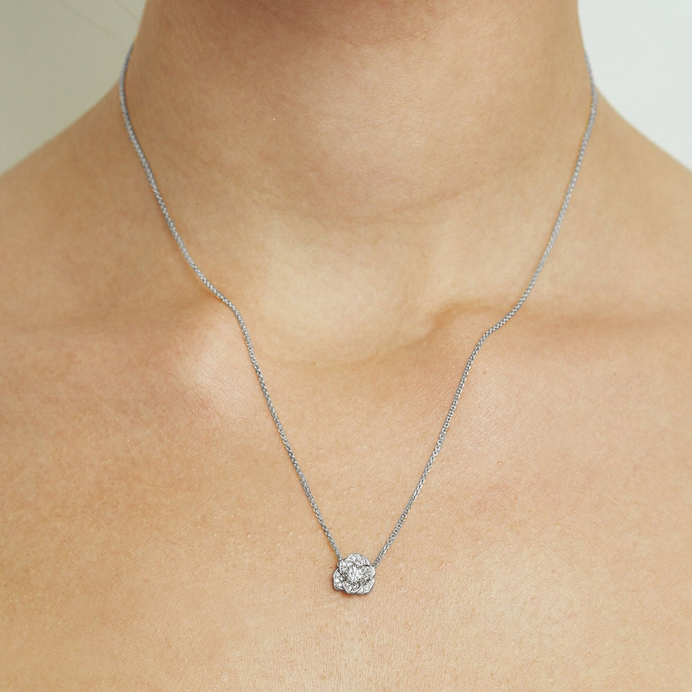 Model wearing Jewellers District's Flower Diamond Necklace with Diamond Pavé in 10k White Gold