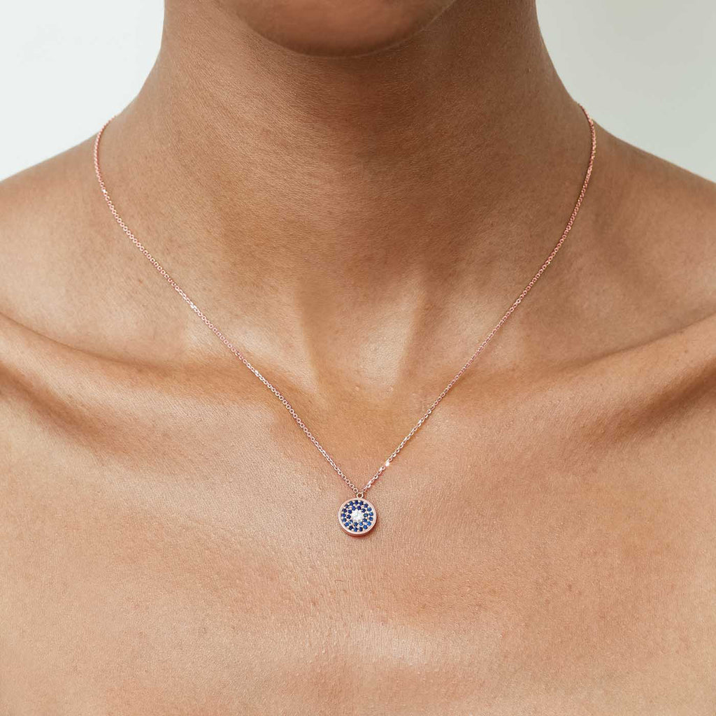 Model wearing Jewellers District's Evil-Eye Pendant Necklace in 10k Rose Gold