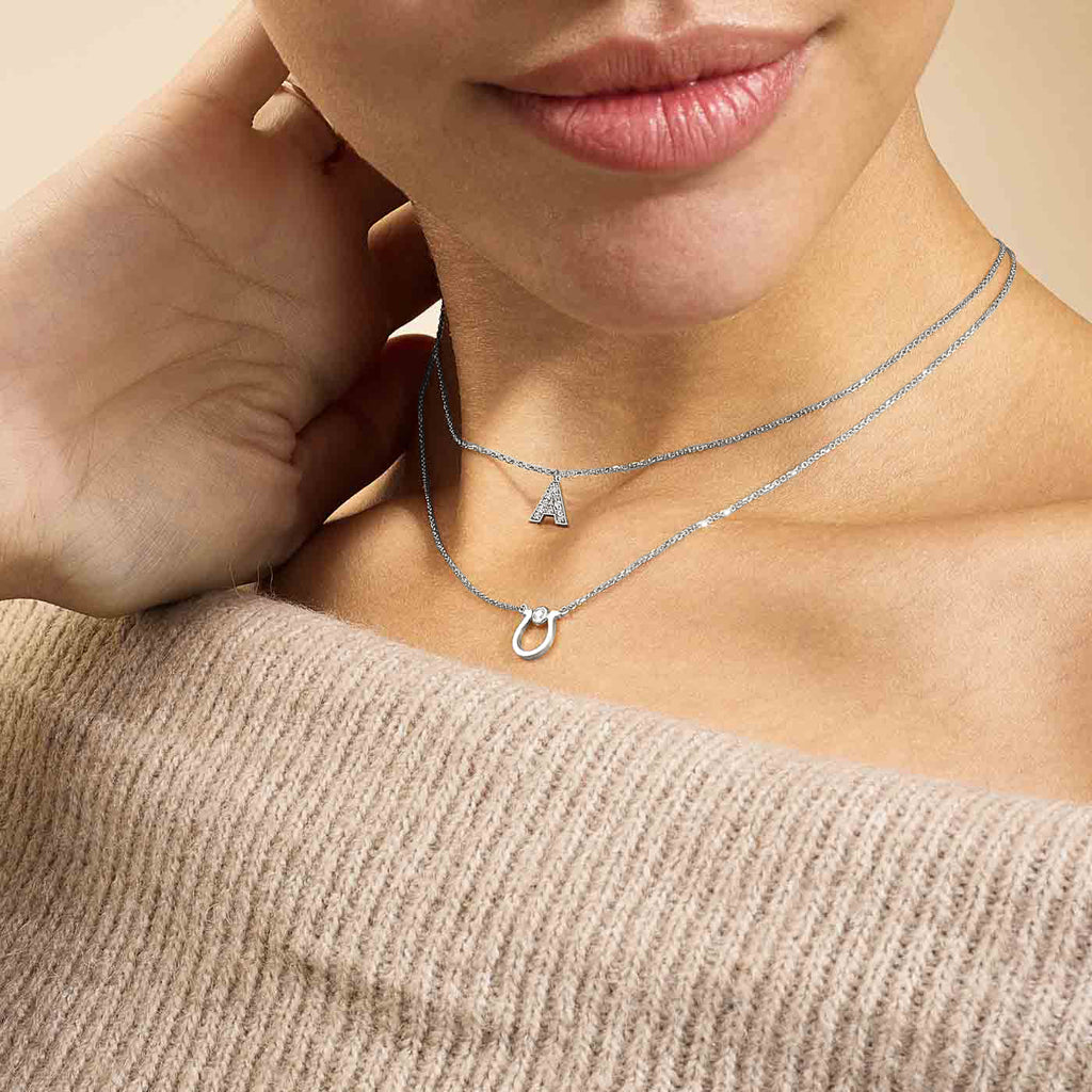 Model wearing Jewellers District's Initial Diamond Pavé Necklace : A in 14k White Gold #2