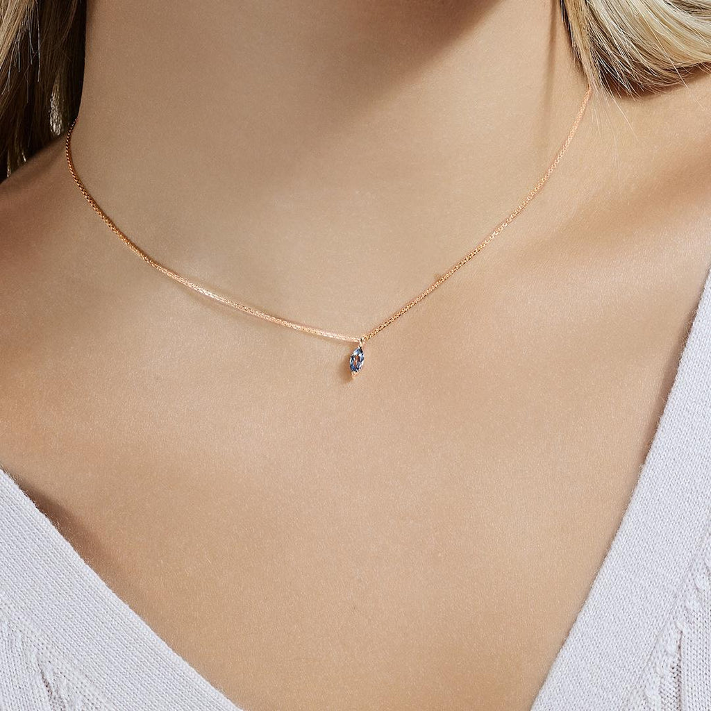 Model wearing Jewellers District's Marquise Aquamarine Pendant Necklace in 10k Rose Gold #2