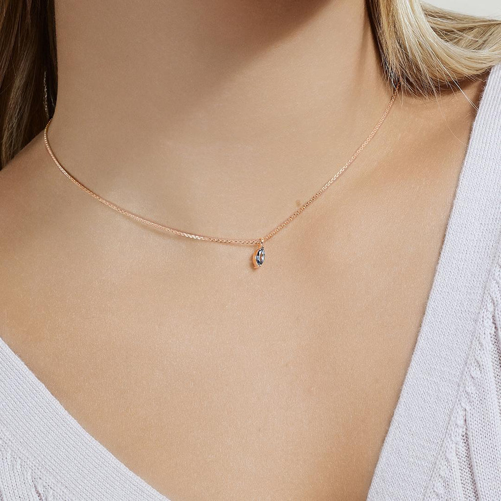 Model wearing Jewellers District's Marquise Aquamarine Pendant Necklace in 10k Rose Gold #3