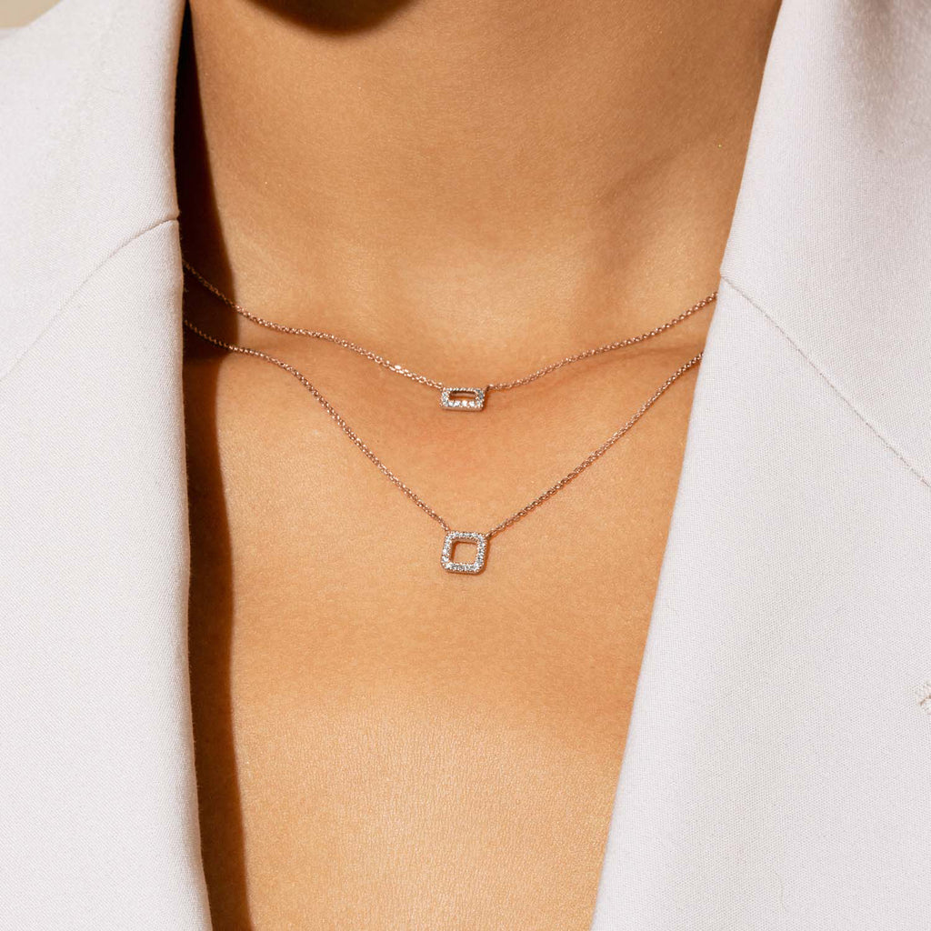 Model wearing Jewellers District's Square Diamond Pavé Pendant Necklace in 10k Rose Gold