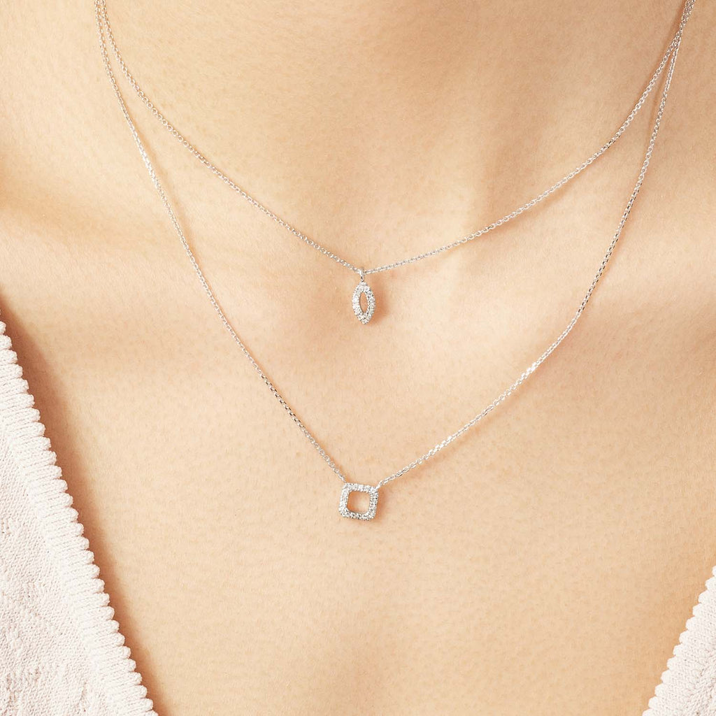 Model wearing Jewellers District's Square Diamond Pavé Pendant Necklace in 10k White Gold #2