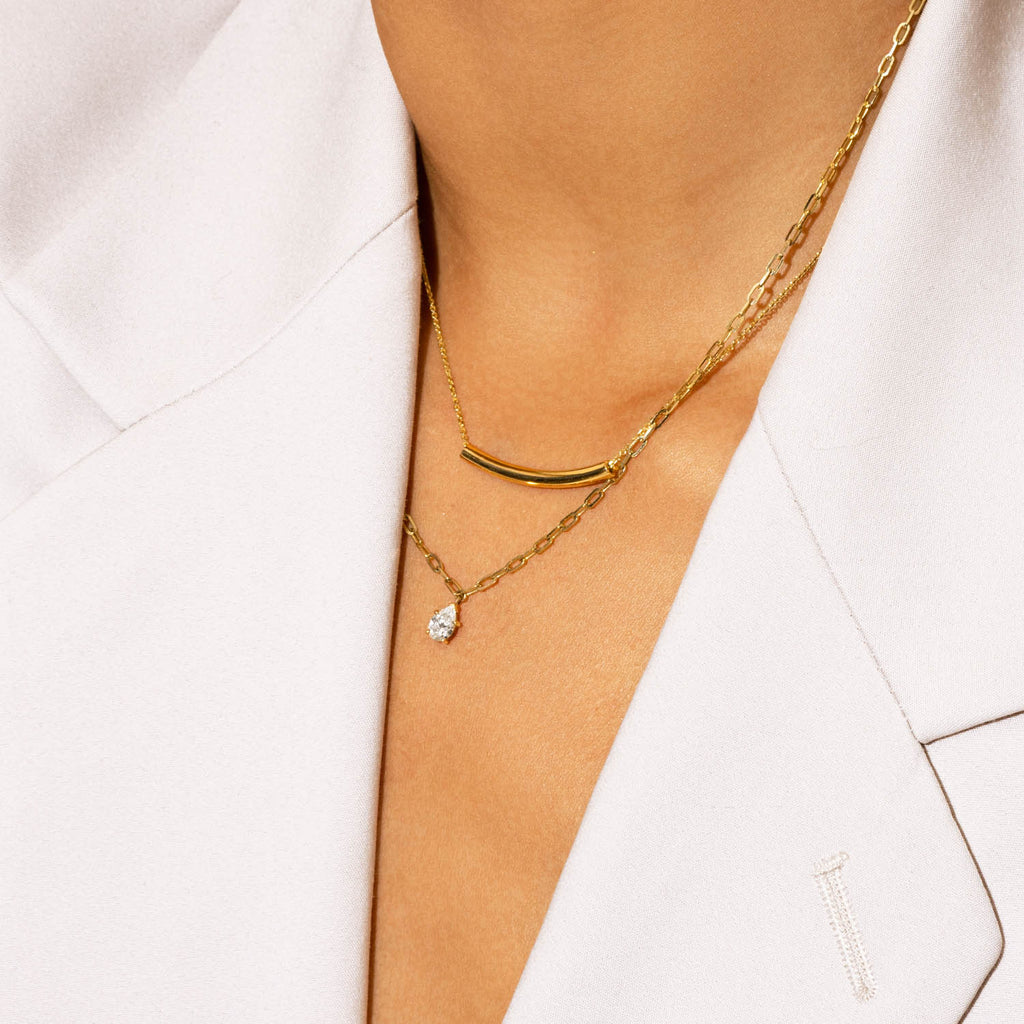 Model wearing Jewellers District's Arc of Life Curved Gold Necklace in 10k Yellow Gold #4