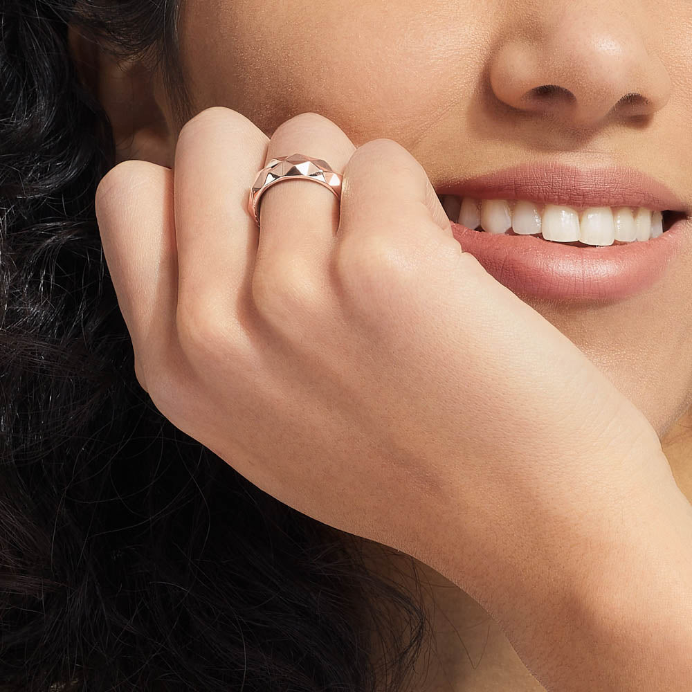 Model wearing Jewellers District's Faceted Gold Bombe Ring in 14k Rose Gold