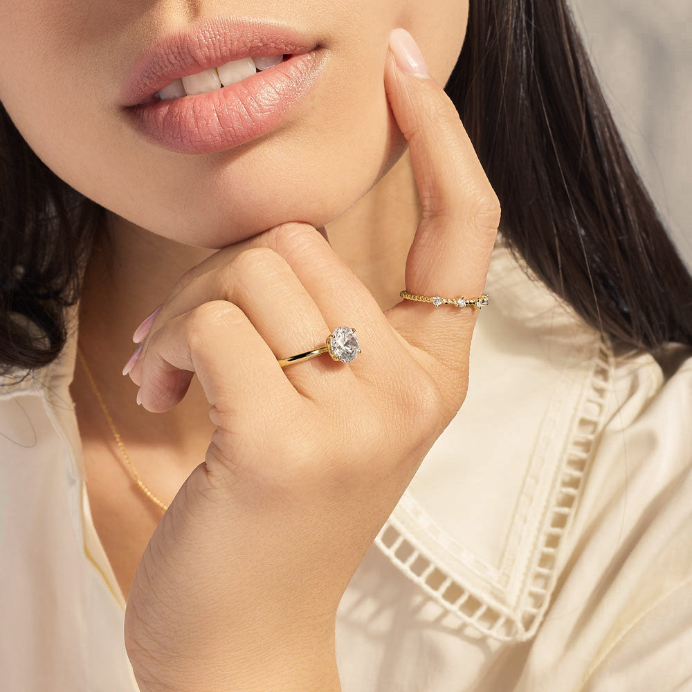 Model wearing Jewellers District's Two-Prong Diamond Wedding Ring in 14k Yellow Gold #4