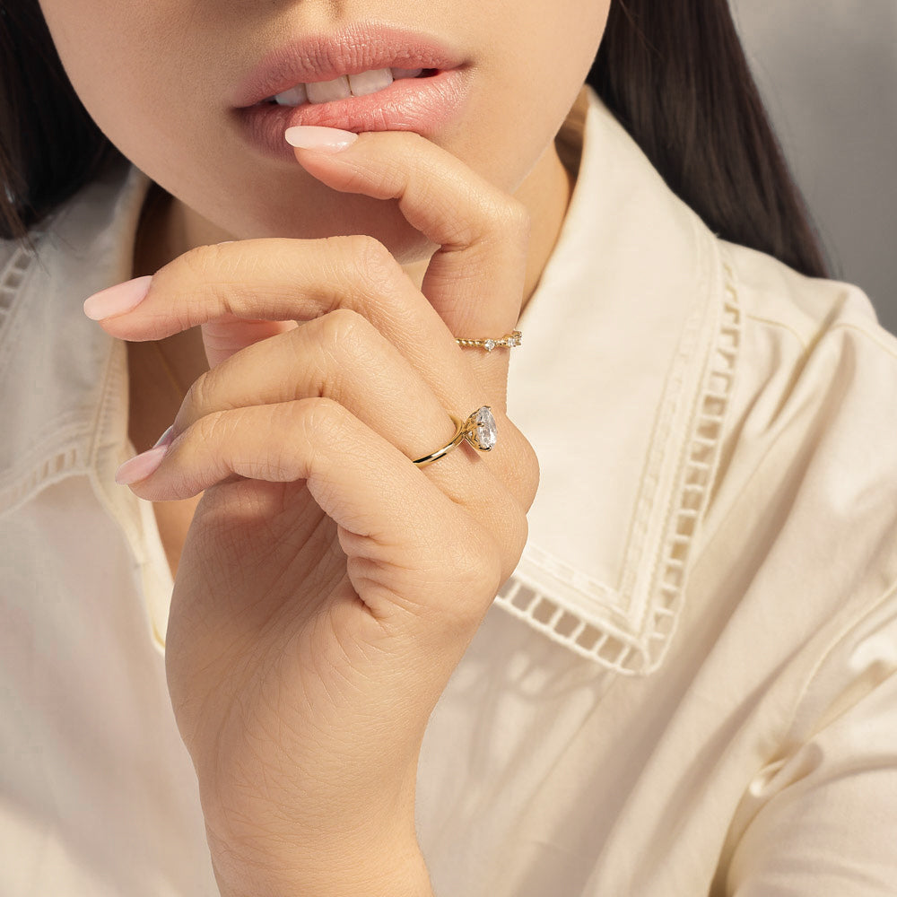 Model wearing Jewellers District's Two-Prong Diamond Wedding Ring in 14k Yellow Gold #2