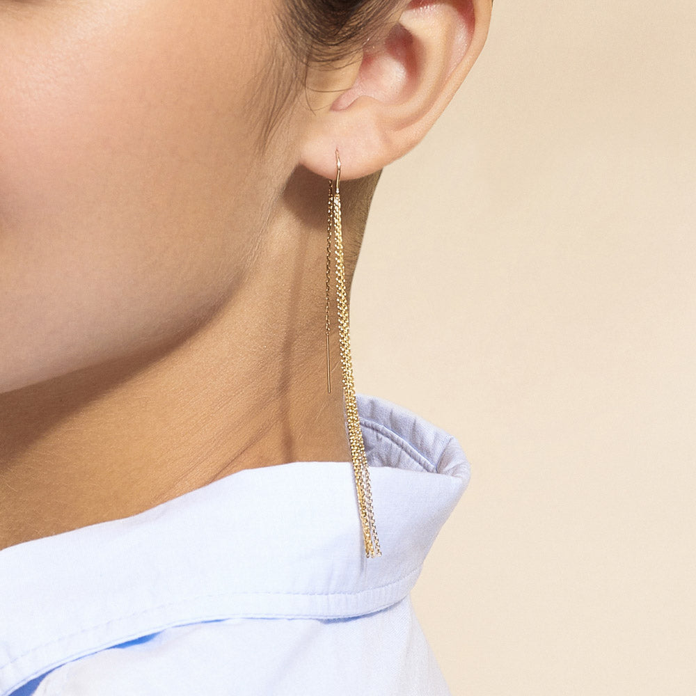 Model wearing Jewellers District's Gold Tassel Dangle Earrings in 14k Yellow Gold #4