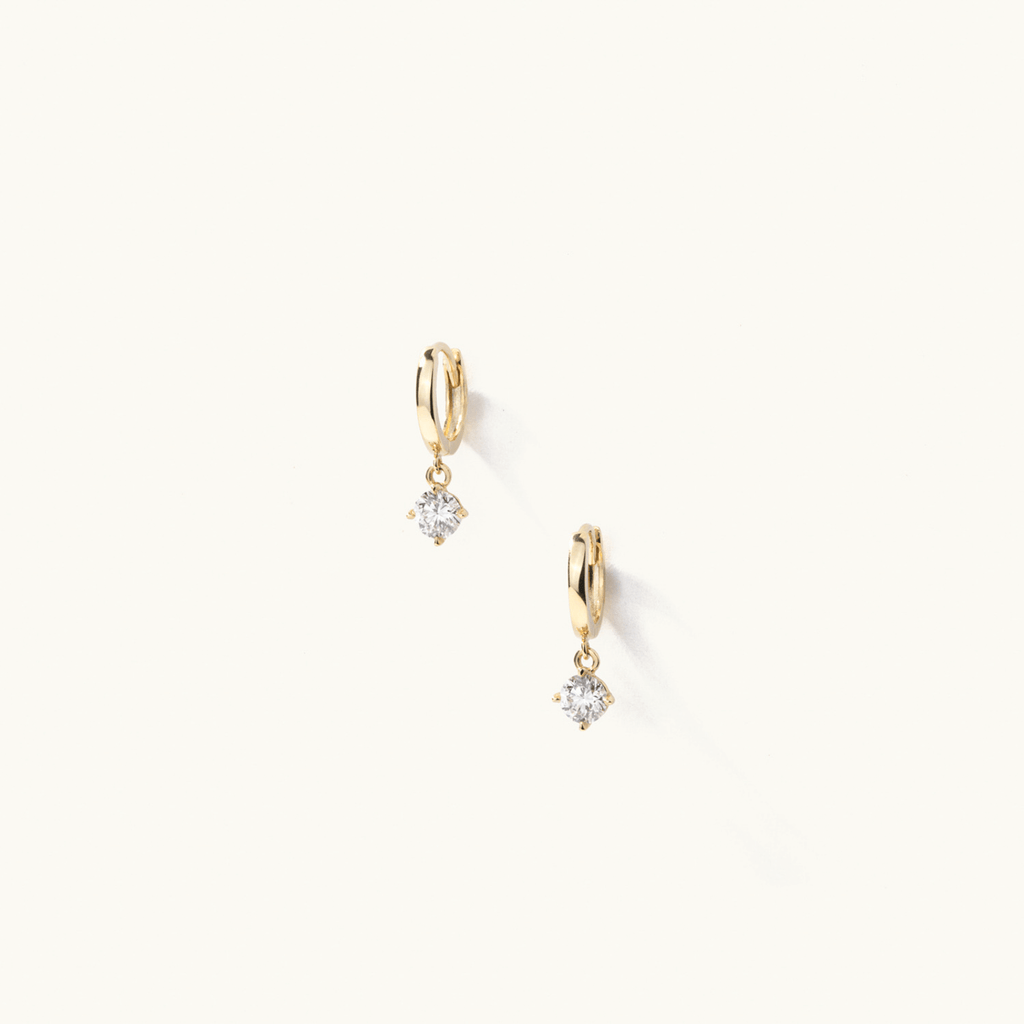 Face view of Jewellers District's Gold Hoop Earrings with Round Cut Diamond Charm in 14k Yellow Gold