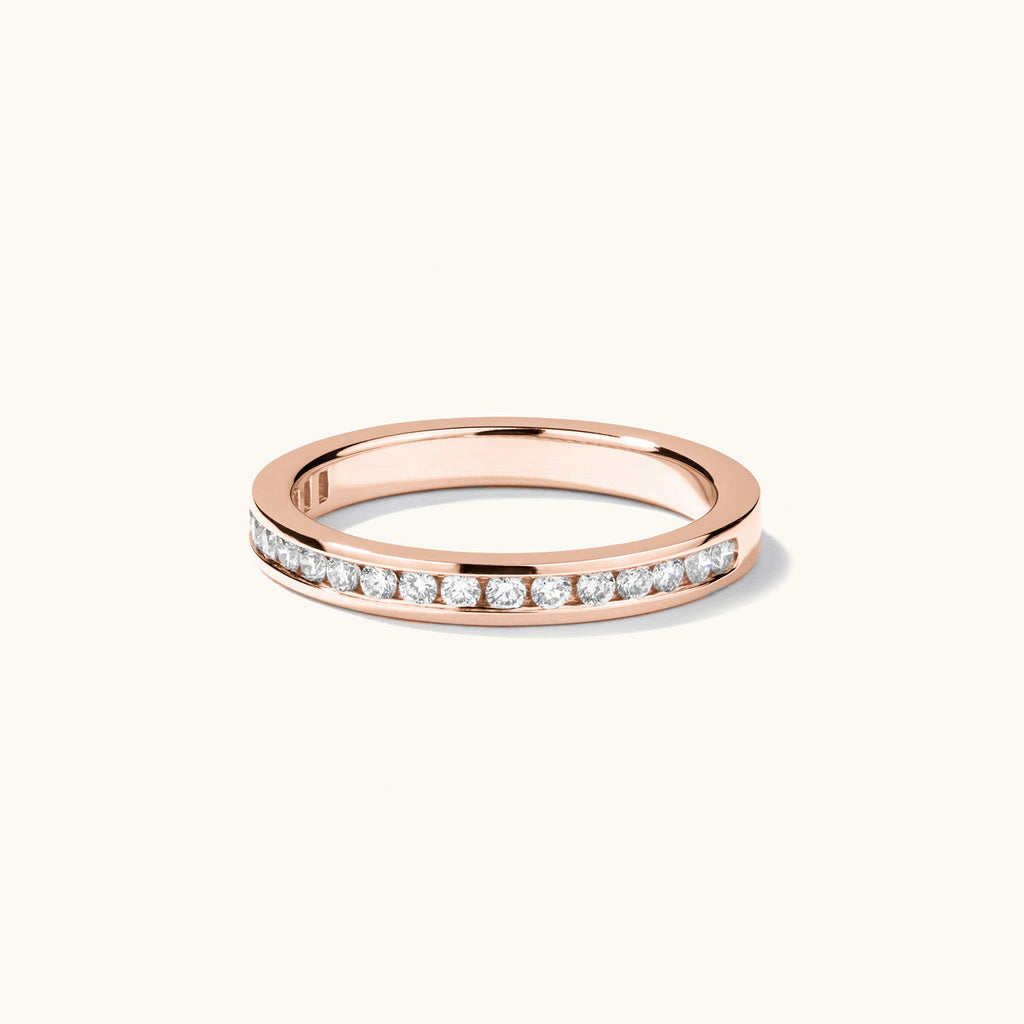 Face view of Jewellers District's Channel-Set Diamond Pavé Wedding Ring in 14k Rose Gold