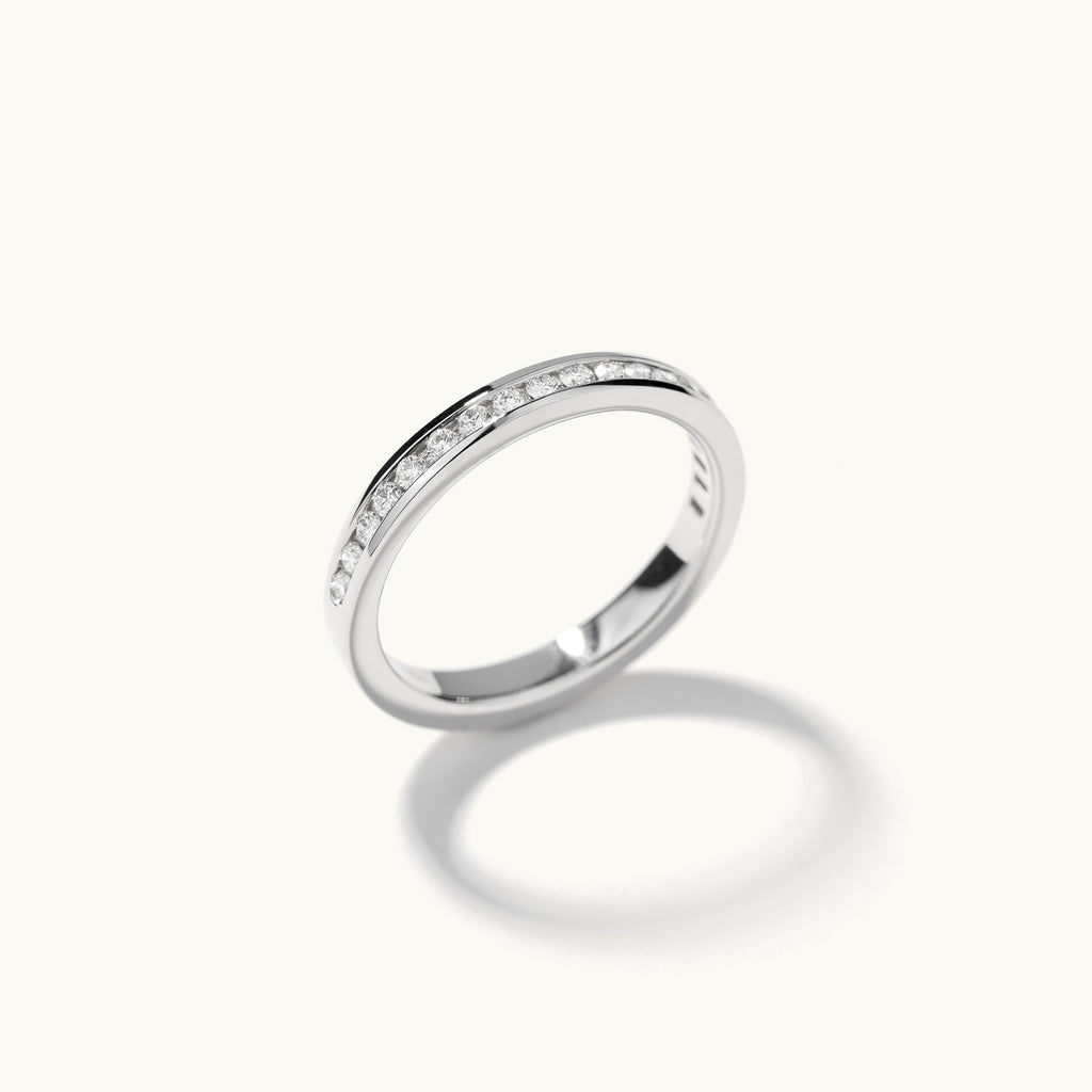 Profile view of Jewellers District's Channel-Set Diamond Pavé Wedding Ring in 14k White Gold