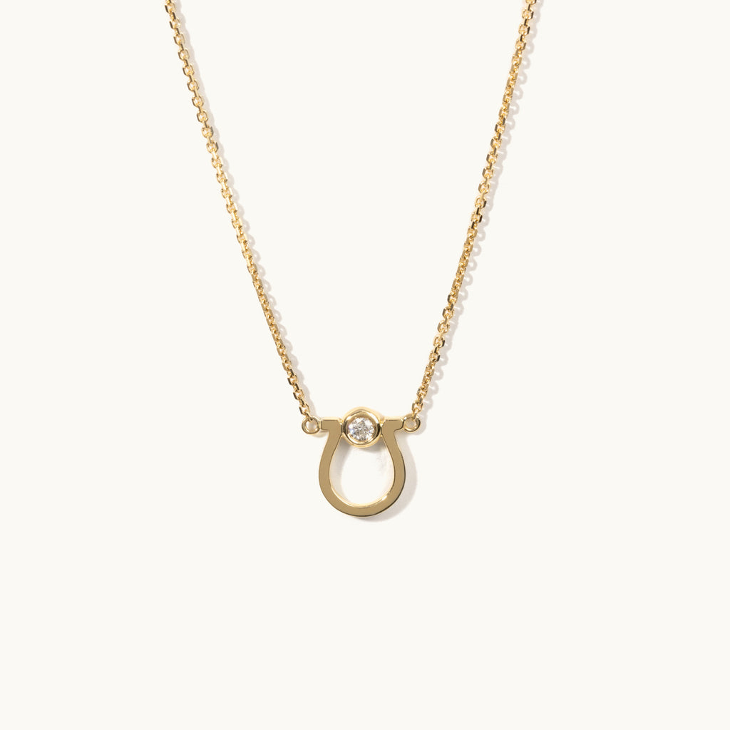 Jewellers District's Horseshoe Pendant Necklace with Accent Diamond in 10k Yellow Gold