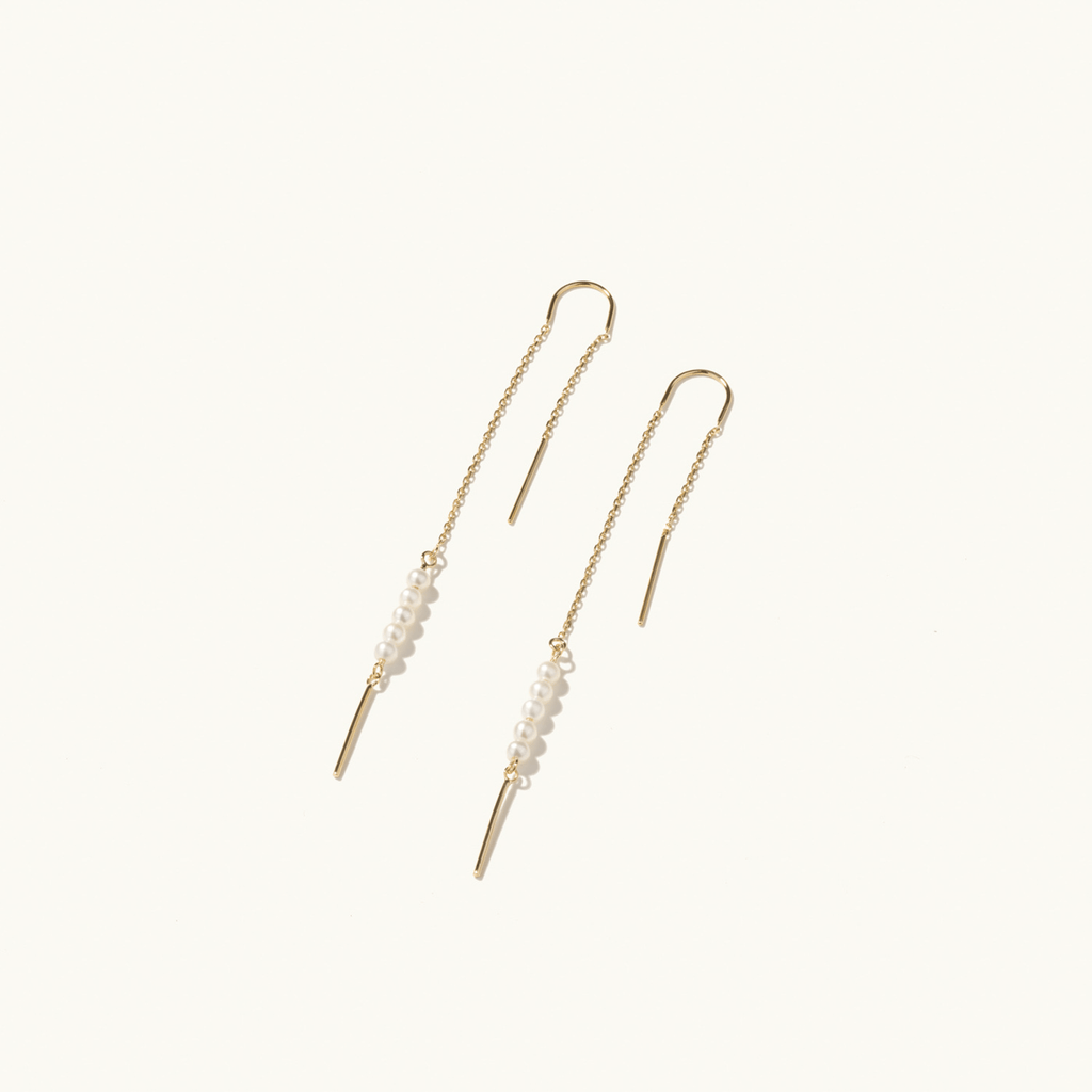 Profile view of Jewellers District's Freshwater Pearl String Threader Earrings in 14k Yellow Gold