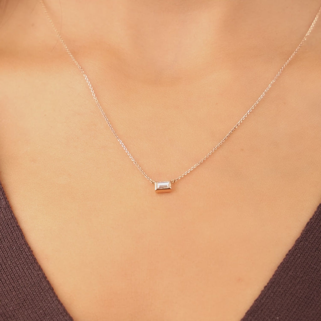 Video showcasing Jewellers District's Baguette-Cut Bezel-Set Diamond Pendant Necklace in 10k White Gold